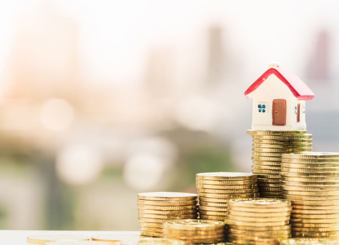 House on stack of coins