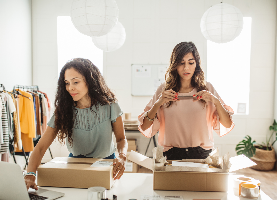 two women packaging orders